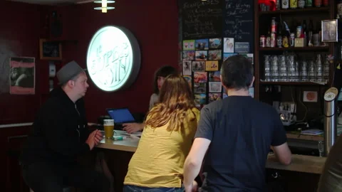 Group Of People Talking At Cozy Bar Counter Stock Footage 344664994