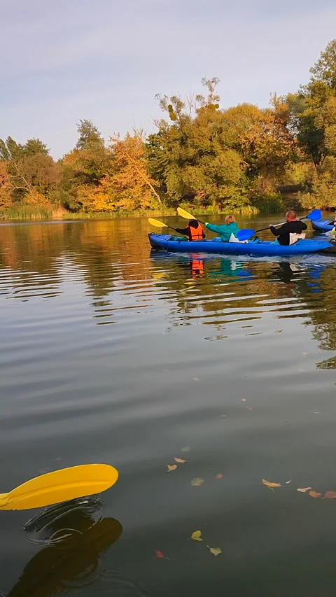 Group people three sitting inflatable boat rowing oar floating river Vertical Stock Footage 295171264