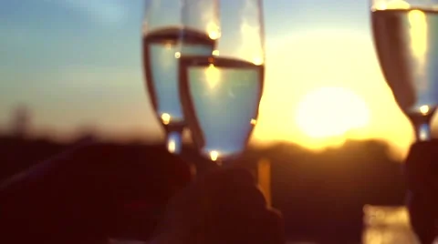 Group of people toasting and drinking champagne over sunset. Stock Footage