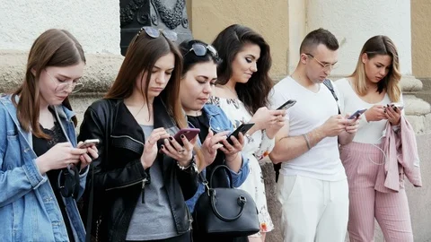 Group of people using the mobile phone, surf the Internet, play the game and use Stock Footage 113747995