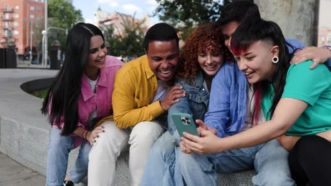 Group of people using mobile phone for social media app. Happy friends   Stock Footage 288318574
