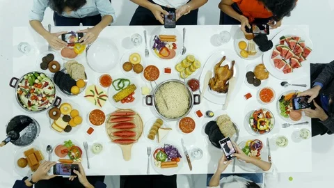 Group of people using smartphone to take photo food on the table before dinner. Stock Footage 95801851