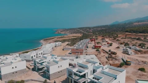 A group of people visit properties in Esentepe, North Cyprus on sunny day Stock Footage 235534341