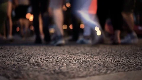Group of People waking at night, focus in foreground Stock Footage 77752298