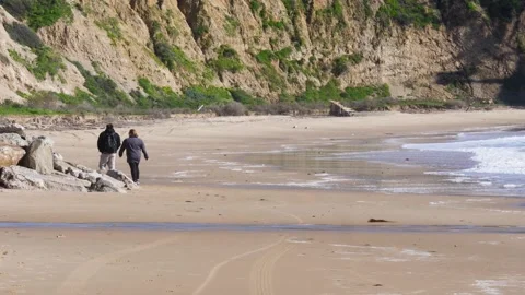 A group of people walking on a beach 動画素材 155590836