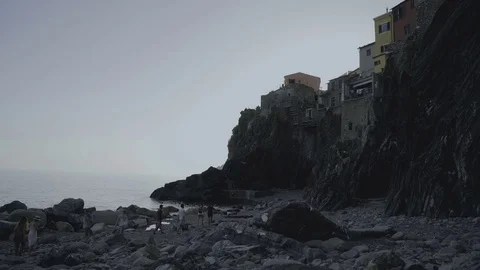 Group of People Walking below a Cliff Video stock 79656532