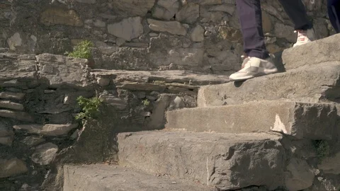 Group of people walking down stone steps Stock Footage 88142130