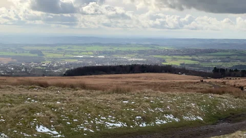 Group of people walking down the Winter Hill, Bolton stadium and motorway. Stock-Footage 329124303