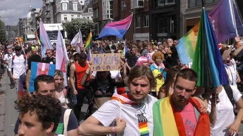 Group of people walking during a pride parade in Antwerp Stockbeeldmateriaal 114003247