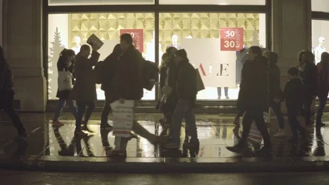 Group of people walking infront of the shops for Christmas shopping Stock Footage 87147912