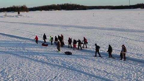 Group of people walking in snowy path on lake ice, Lappeenranta Finland Stock-Footage 169344948