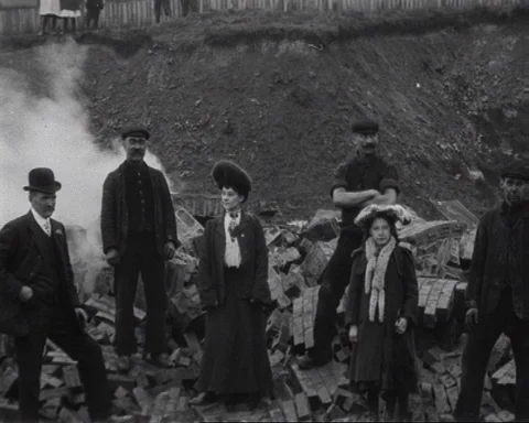 Group of people waving at camera after chimney explosion, UK 1906 Stock Footage 136820865