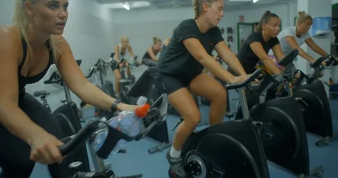 A group of people working out at a exercise bike class. Stock-Footage 85536891