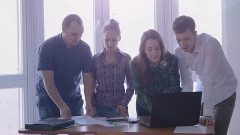 Group of people at the working place in a stylish office with large panoramic Stock Footage 86190817
