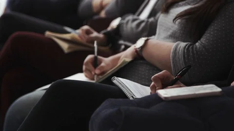 A group of people is writing in a notebook Stock Footage 105484051