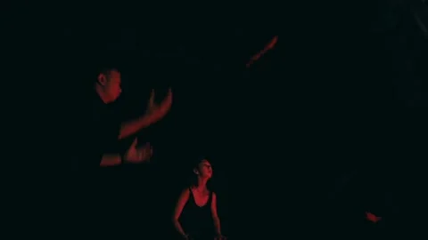 Group Performing Synchronized Ritual Dance in Dark Red Light. Stock Footage 232905781