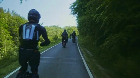 Group of PEV riders in Cwmcarn Forest, electric unicycle, electric skateboard Stock Footage 196807341