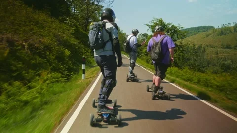 Group of PEV riders in Cwmcarn Forest, electric unicycle, electric skateboard Stock Footage 196807343