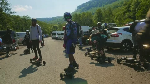 Group of PEV riders in Cwmcarn Forest, electric unicycle, electric skateboard Stock Footage 196807482