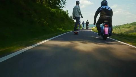 Group of PEV riders in Cwmcarn Forest, electric unicycle, electric skateboard Stock Footage 196807582