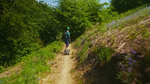 Group of PEV riders in Cwmcarn Forest, electric unicycle, electric skateboard Stock Footage 196808102
