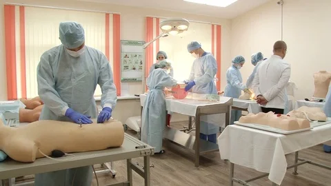 A group of physicians participate in practical exercises. Stock Footage 103188564