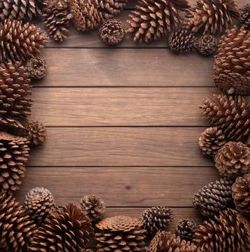 Group of pinecones over wooden table with copy space Stock Photos