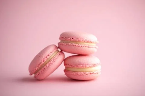Group pink macaroons macro folded one on one on a pink background Stock Photos