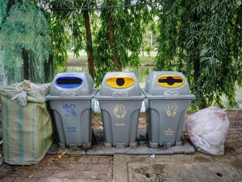 Group of Plastic Trash Bins with Different Types of Waste Separation Foto stock