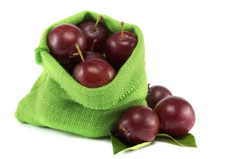 Group of plums with leaf isolated on a white background. Stock Photos