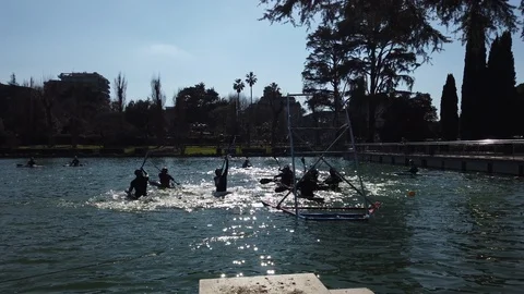 Group of polo canoe players. Backlight. Slowmotion. Laghetto Eur, Roma. Stock Footage 125285188