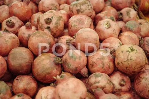 Group of pomegranates background. Pomegranates in supermarket Stock Photos