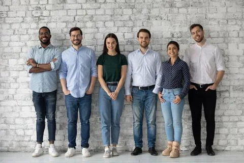 Group portrait of diverse millennial team of employees Stock Photos