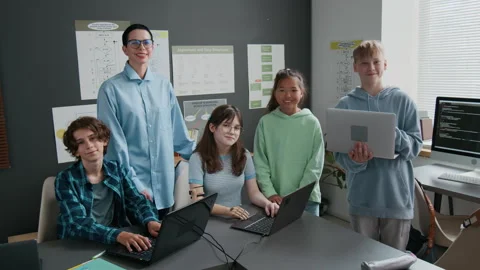 Group Portrait of Middle-School Students with Teacher During IT Class in School Stock Footage 317643666