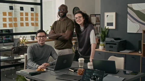 Group Portrait of Three Cheerful Young Male Programmers in Office of IT Company Video stock 329615008