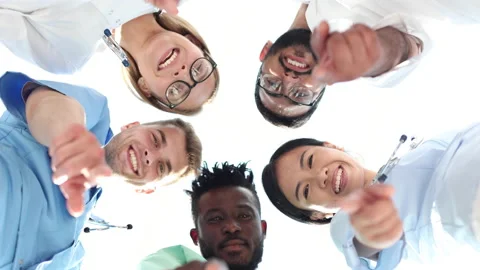 Group of practicing doctors pointing their finger at you Stock Footage 230974129