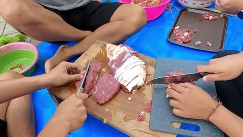 Group preparing meat and vegetables for satay Stock-Footage 279342085