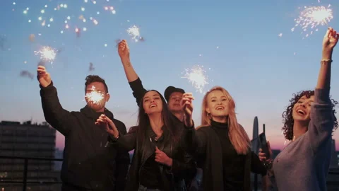 A group of pretty and glamorous young friends standing on the roof of the city Stock Footage 109090247
