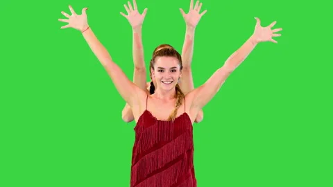 A group of pretty young ladies dressed in red performing some movements from Stock Footage 219465712