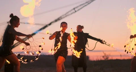 A group of professional circus performers with fire shows dance shows in slow Stock Footage 111202053