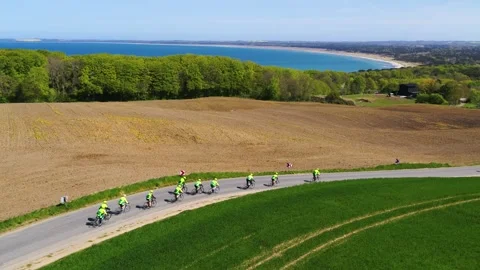 Group of professional cyclists biking through beautiful Danish landscape Video stock 298653495