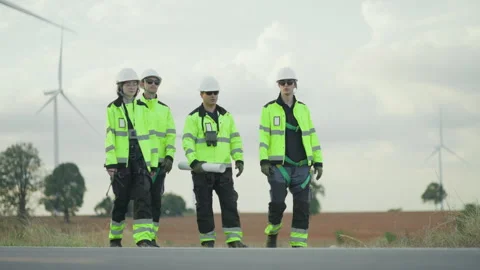 Group of professional engineers in high-visibility safety uniforms Stock Footage 325553500