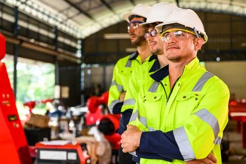 Group of professional mechanical engineer team checking and repairing engine Stock Photos