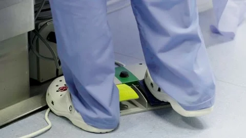 A group of professional mixed race surgeons in uniform performing Stockbeeldmateriaal 269447613