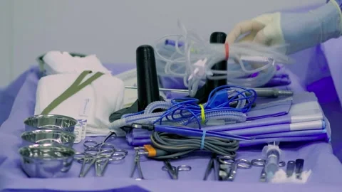 A group of professional mixed race surgeons in uniform performing Stock Footage 270461633