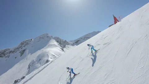 A group of professional skiers ride synchronously Stock Footage 132391953