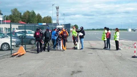 Group of professional skydivers in jumpsuits preparing for a high altitude Stock Footage 159781005