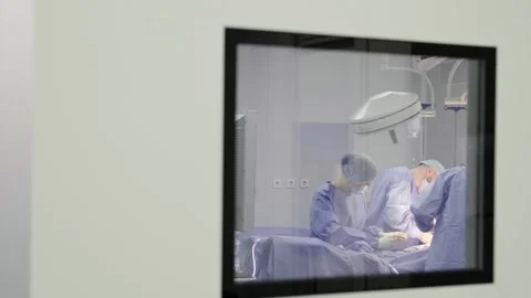 A group of professional surgeons in uniform perform an operation Stock Footage 269438149