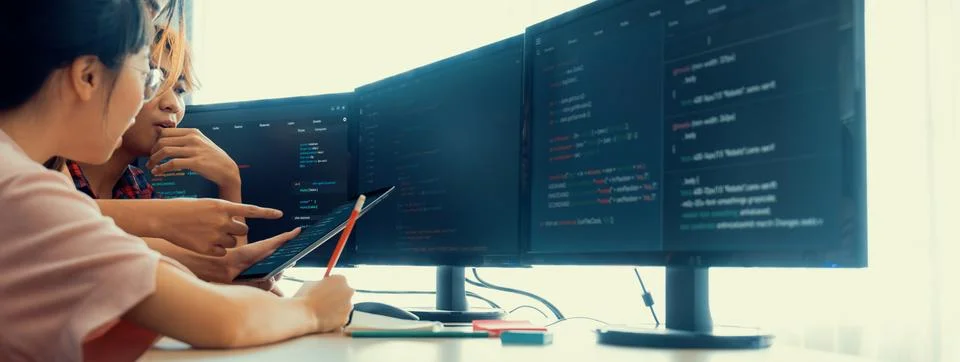 Group of professional web developer discuss about data analysis. Burgeoning. Stock Photos