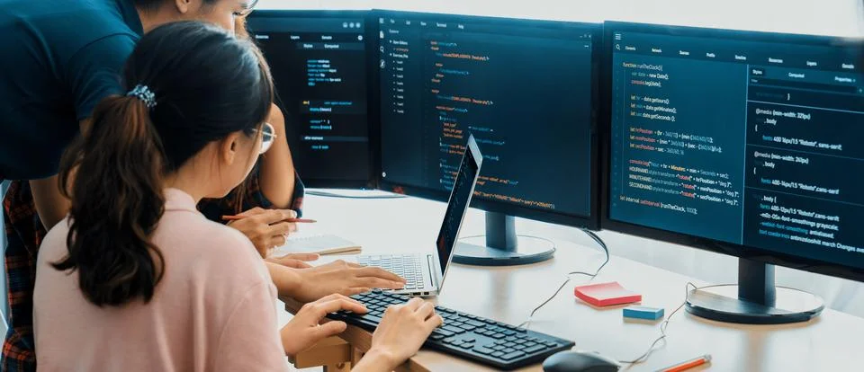 Group of professional web developer discuss about data analysis. Burgeoning. Stock Photos